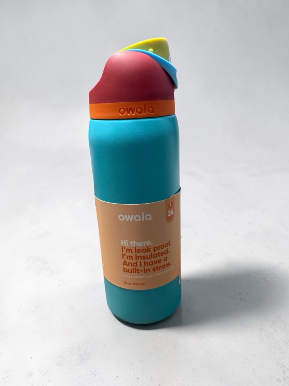 Owala Insulated Turquoise Water Bottle with Pink Lid